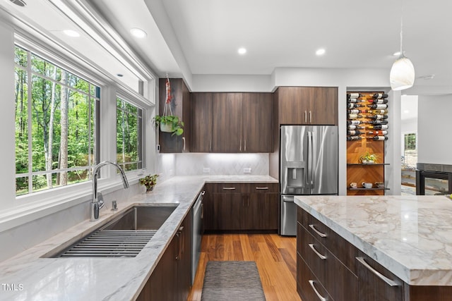 1115 Trailwood Dr, Raleigh, NC 27606 - kitchen featuring stainless steel appliances, a sink, plenty of natural light, decorative light fixtures, and recessed lighting