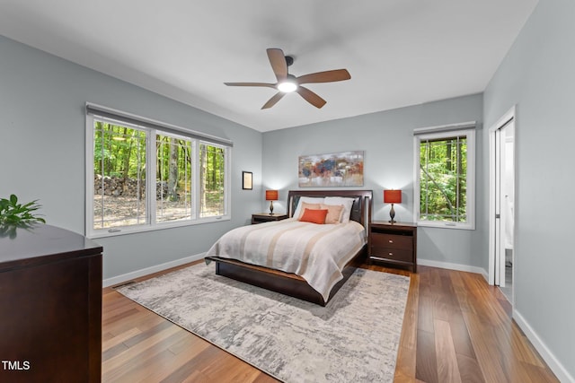 1115 Trailwood Dr, Raleigh, NC 27606 - bedroom with wood finished floors, baseboards, and ceiling fan