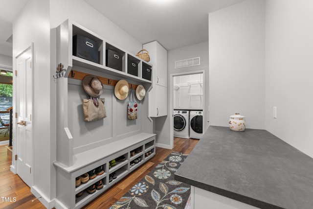 1115 Trailwood Dr, Raleigh, NC 27606 - mudroom featuring washing machine and dryer and wood finished floors