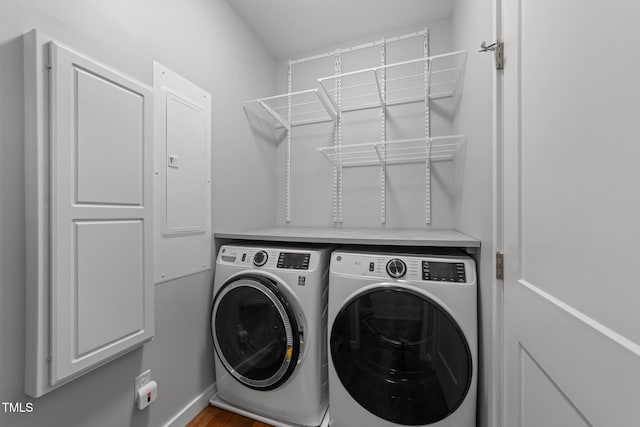 1115 Trailwood Dr, Raleigh, NC 27606 - washroom featuring separate washer and dryer and wood finished floors