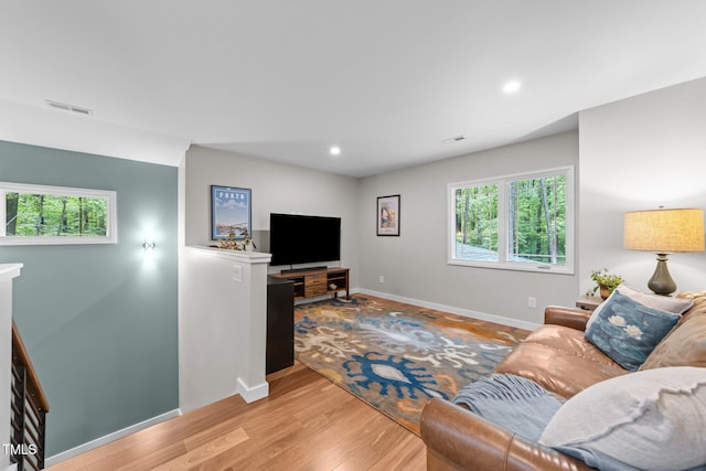 1115 Trailwood Dr, Raleigh, NC 27606 - living room with healthy amount of natural light, baseboards, light wood-style floors, and recessed lighting