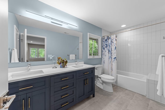 1115 Trailwood Dr, Raleigh, NC 27606 - full bath with plenty of natural light, toilet, double vanity, and shower / bath combination with curtain