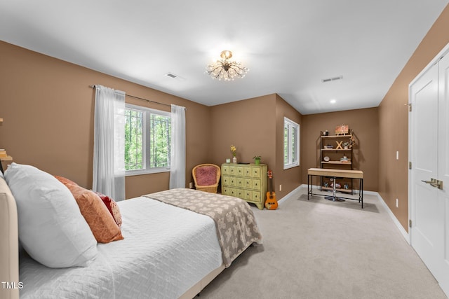 1115 Trailwood Dr, Raleigh, NC 27606 - bedroom with multiple windows, carpet, and baseboards