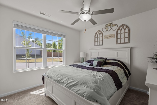 bedroom with carpet floors, baseboards, and a ceiling fan