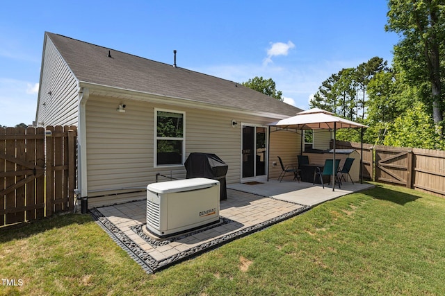 rear view of house with a patio area, a shingled roof, a gazebo, and a gate