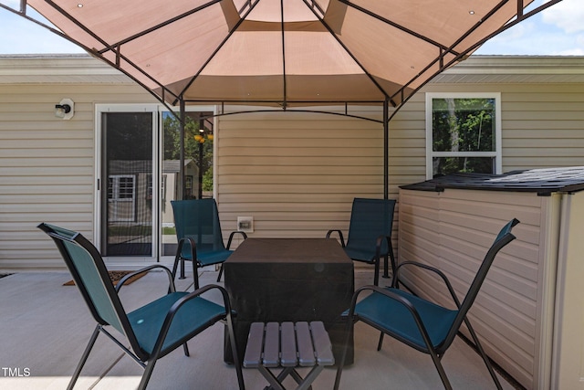 view of patio / terrace featuring a gazebo and outdoor dining space