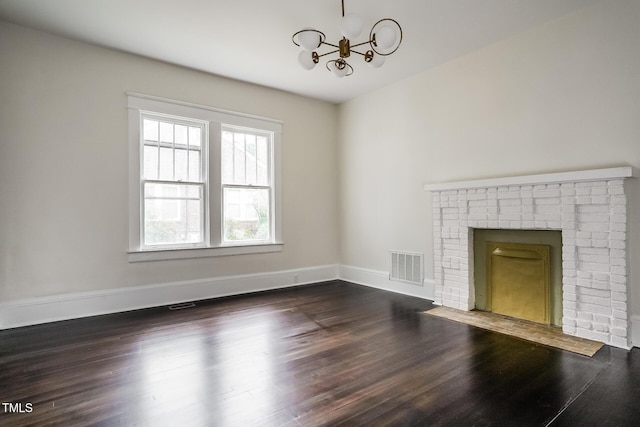 2607 Chapel Hill Rd, Durham, NC 27707 - unfurnished living room with a chandelier, wood finished floors, a fireplace, and baseboards