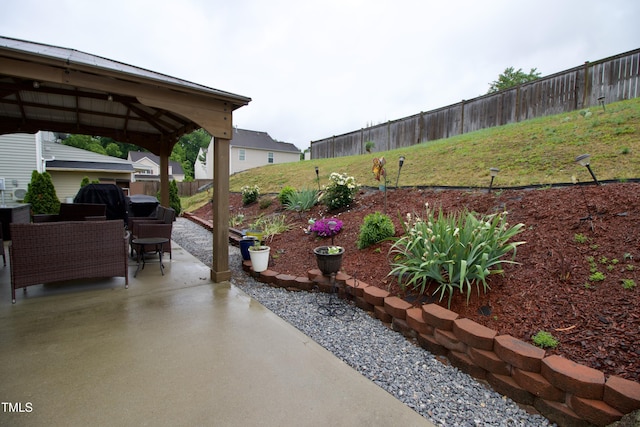 view of patio / terrace with a gazebo and a fenced backyard