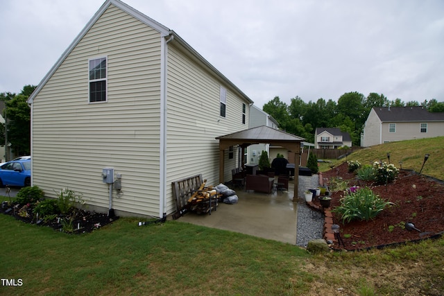 view of home's exterior with a gazebo and a patio area