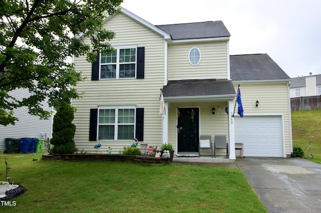 traditional home with driveway, a shingled roof, a front yard, and an attached garage