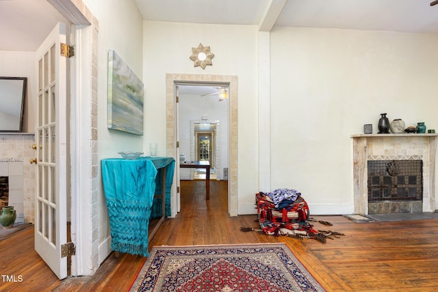 corridor with hardwood / wood-style floors