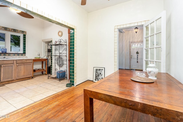 dining room featuring ceiling fan and light wood-style flooring