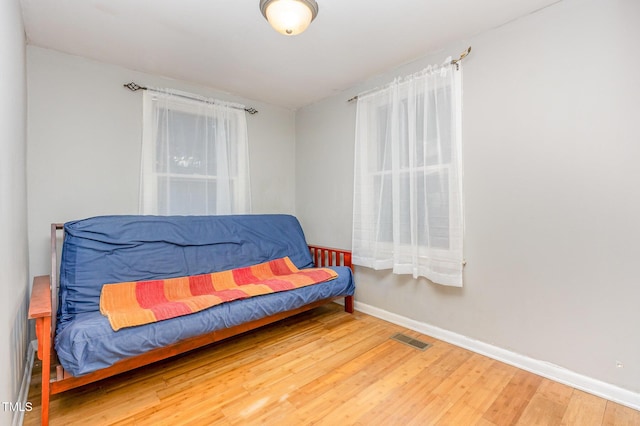 sitting room featuring wood finished floors and baseboards