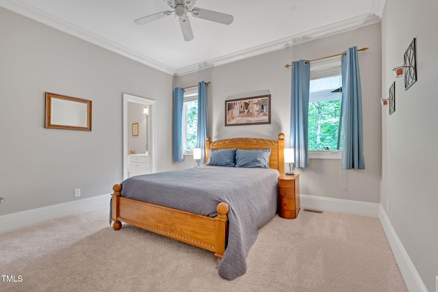 carpeted bedroom featuring crown molding, baseboards, connected bathroom, and ceiling fan