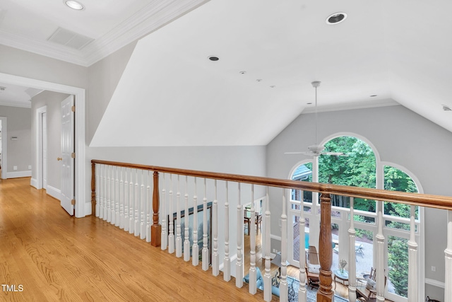 hallway with light wood-type flooring, vaulted ceiling, and recessed lighting