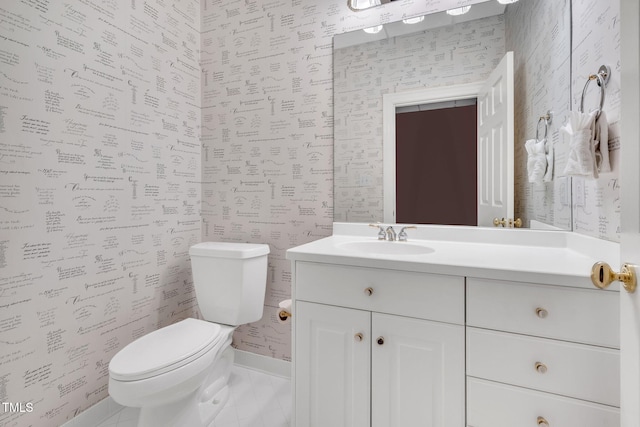 half bath featuring wallpapered walls, toilet, and vanity