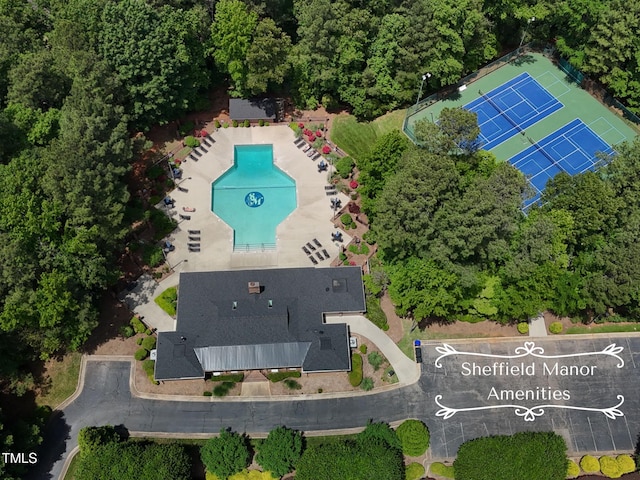 aerial view of property and surrounding area featuring a pool area