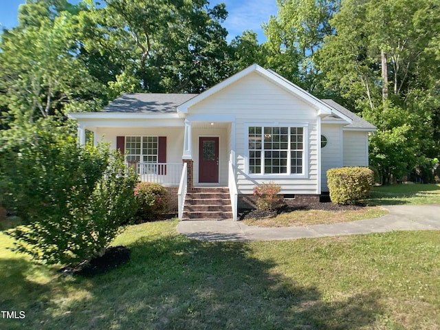 2747 Michelle Ct, Creedmoor, NC 27522 - view of front of property with a porch, a front lawn, and roof with shingles