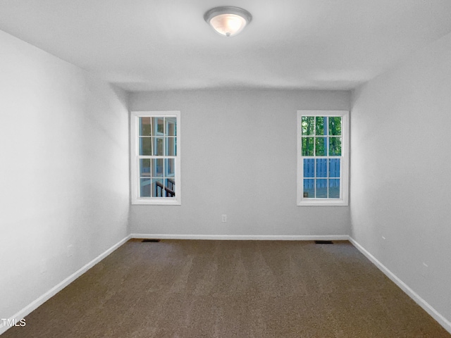 2747 Michelle Ct, Creedmoor, NC 27522 - unfurnished room featuring dark colored carpet and baseboards