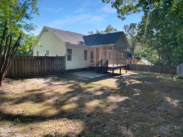 2747 Michelle Ct, Creedmoor, NC 27522 - rear view of property featuring a sunroom, a patio, a fenced backyard, and crawl space