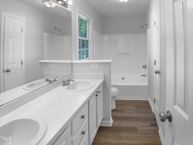 2747 Michelle Ct, Creedmoor, NC 27522 - full bathroom featuring wood finished floors, toilet, double vanity, and shower / bath combination