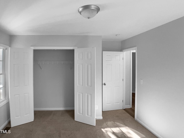 2747 Michelle Ct, Creedmoor, NC 27522 - unfurnished bedroom with a closet, carpet, and baseboards