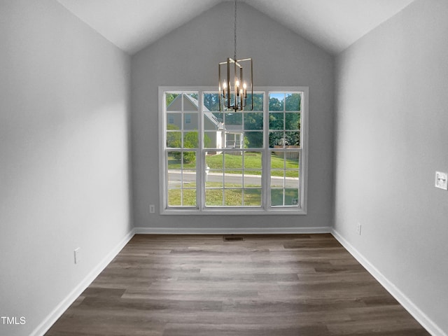 2747 Michelle Ct, Creedmoor, NC 27522 - unfurnished dining area featuring a chandelier, plenty of natural light, dark wood-type flooring, and lofted ceiling