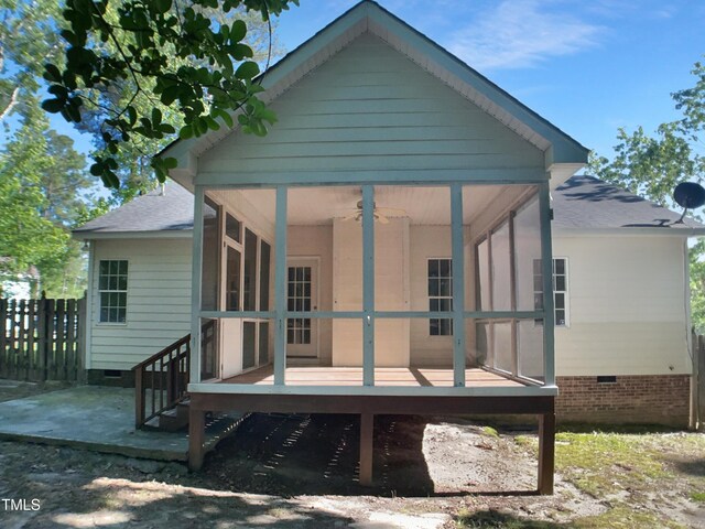 2747 Michelle Ct, Creedmoor, NC 27522 - back of property with a sunroom, a ceiling fan, a shingled roof, fence, and crawl space