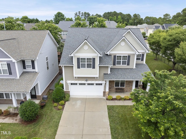 1720 Laurel Park Pl, Cary, NC 27511 - view of front of property with driveway, a garage, a shingled roof, stone siding, and a residential view