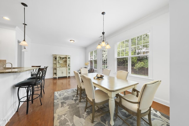 1720 Laurel Park Pl, Cary, NC 27511 - dining room with crown molding, dark wood-style flooring, and baseboards
