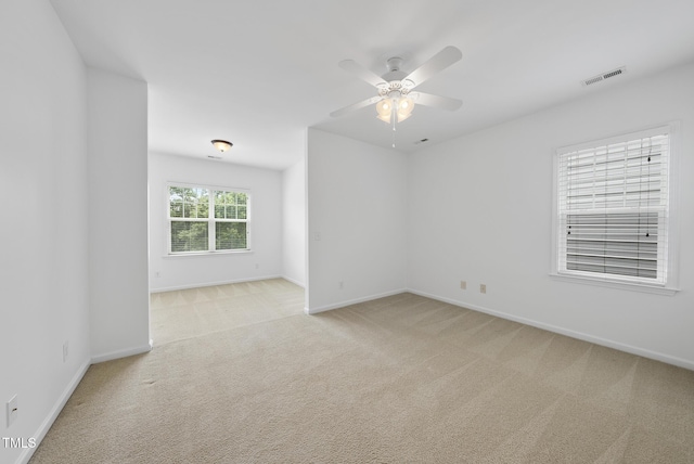 1720 Laurel Park Pl, Cary, NC 27511 - spare room featuring light carpet, baseboards, and ceiling fan