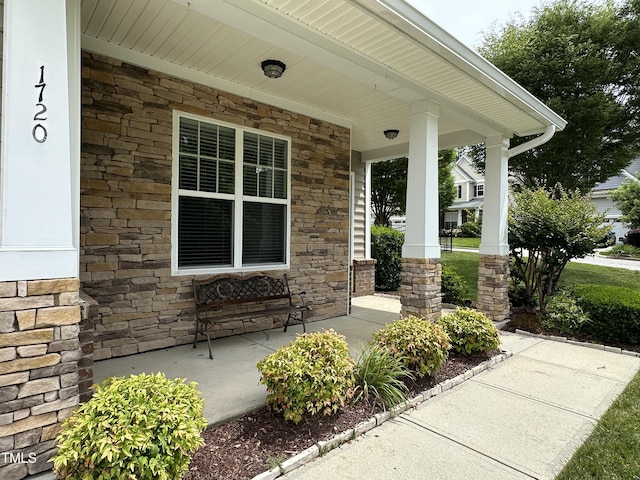 1720 Laurel Park Pl, Cary, NC 27511 - doorway to property with covered porch and stone siding