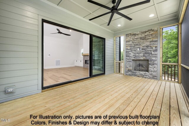 wooden terrace with a ceiling fan