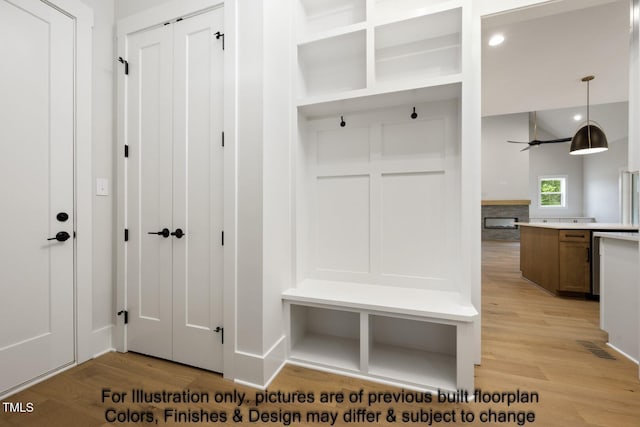 mudroom featuring light wood finished floors, a ceiling fan, and recessed lighting
