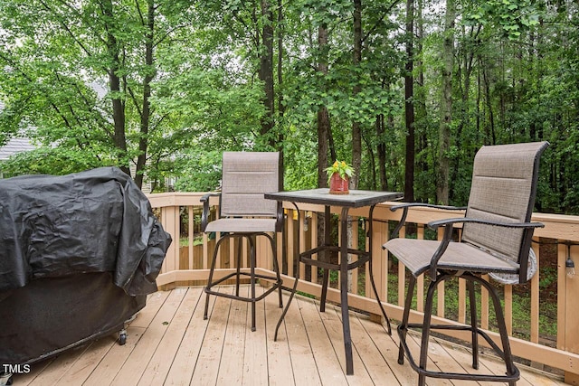5629 Yates Garden Ln, Raleigh, NC 27606 - wooden deck with a grill and outdoor dining area
