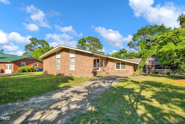 5830 Mcdougal Dr, Fayetteville, NC 28304 - single story home featuring brick siding, a front lawn, driveway, and crawl space