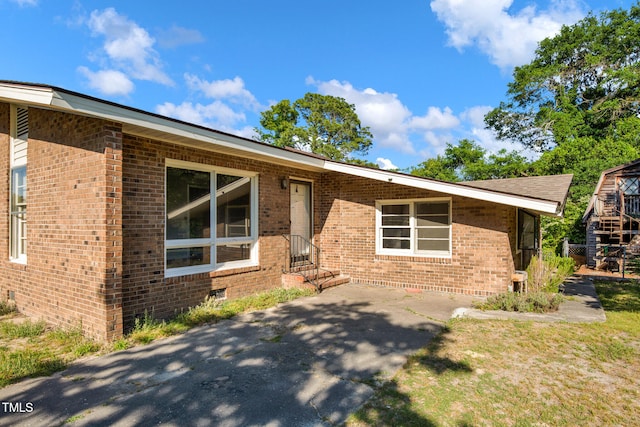 5830 Mcdougal Dr, Fayetteville, NC 28304 - view of front of house featuring brick siding