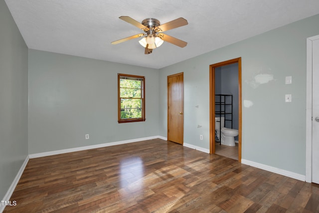 5830 Mcdougal Dr, Fayetteville, NC 28304 - unfurnished bedroom featuring wood finished floors, baseboards, connected bathroom, and a ceiling fan