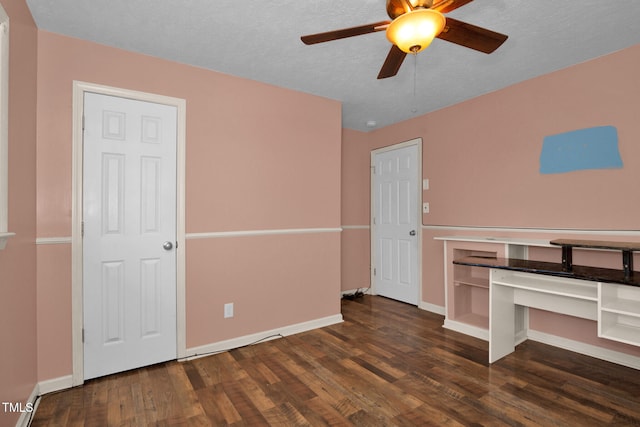 5830 Mcdougal Dr, Fayetteville, NC 28304 - unfurnished bedroom with wood finished floors, baseboards, a ceiling fan, and a textured ceiling