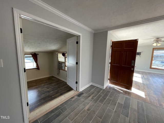 5830 Mcdougal Dr, Fayetteville, NC 28304 - foyer featuring healthy amount of natural light, dark wood-style floors, baseboards, a textured ceiling, and ornamental molding