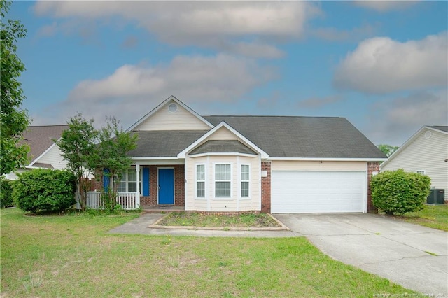 view of front of home featuring brick siding, an attached garage, and driveway