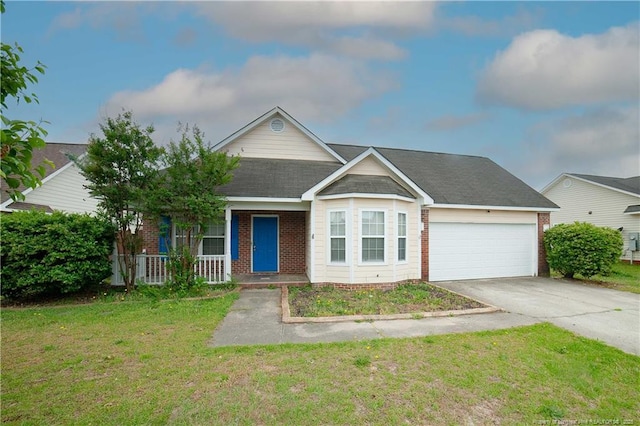 view of front facade with driveway, an attached garage, brick siding, a front yard, and covered porch