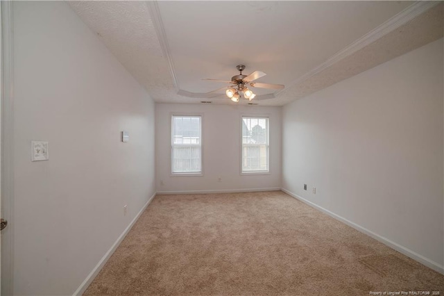 unfurnished room with a ceiling fan, light carpet, and baseboards