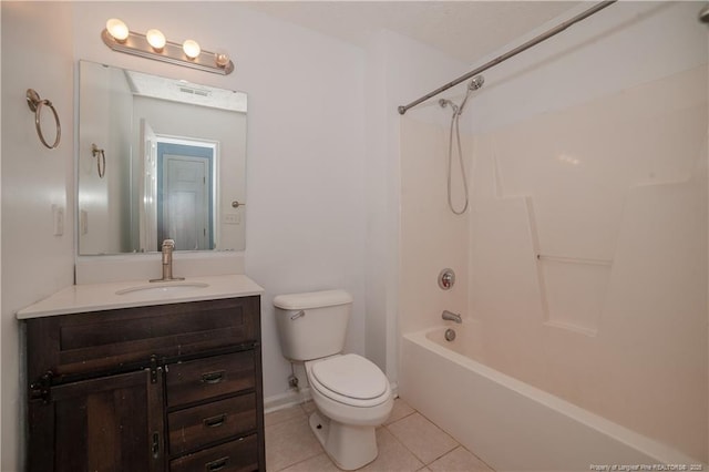 bathroom with tile patterned floors, toilet, vanity, and tub / shower combination