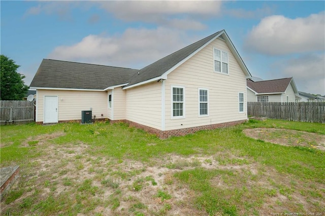 back of property featuring central AC unit