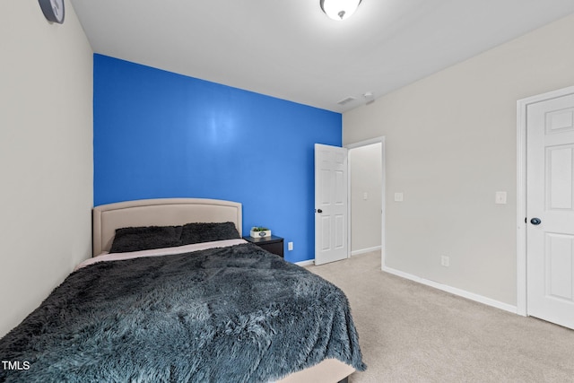 carpeted bedroom with baseboards