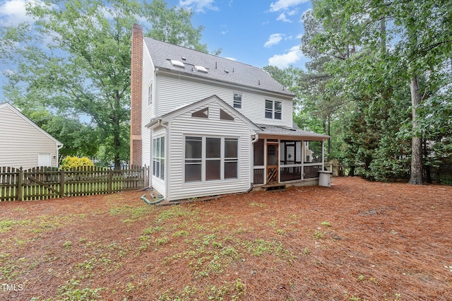 105 Houston Cir, Cary, NC 27513 - rear view of property featuring a chimney, fence, roof with shingles, and a sunroom