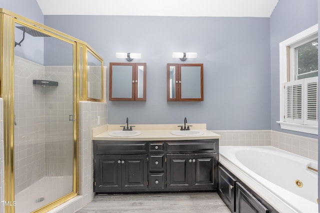 105 Houston Cir, Cary, NC 27513 - bathroom with a stall shower, double vanity, a jetted tub, and wood finished floors