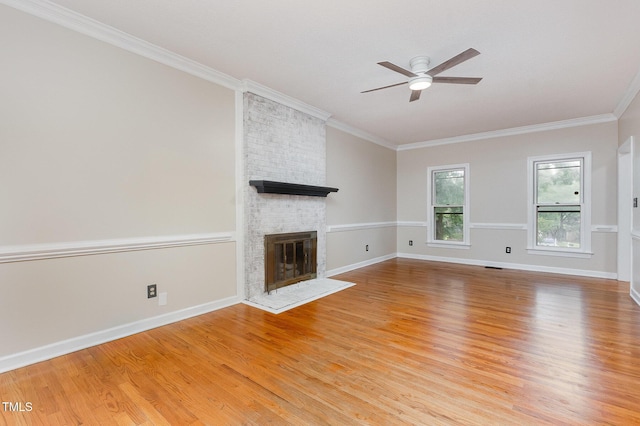 105 Houston Cir, Cary, NC 27513 - unfurnished living room featuring a fireplace, ceiling fan, light wood-type flooring, ornamental molding, and baseboards