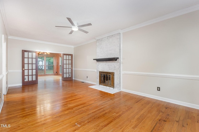 105 Houston Cir, Cary, NC 27513 - unfurnished living room with ceiling fan, light wood finished floors, a brick fireplace, ornamental molding, and baseboards
